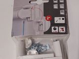 a box of toilet paper on a table next to a remote control