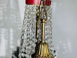 a gold chandelier with crystal beads hanging from it