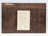 an old piece of wood with a piece of writing on it
