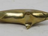 a close up of a metal object on a white surface
