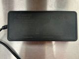 an image of a laptop charger on a metal surface