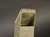 a small metal object that is sitting on a table