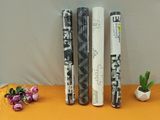 three rolls of wrapping paper sitting on a table next to flowers