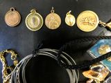 many different types of jewelry on a black table