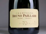 a bottle of champagne sitting on a table with a label on it