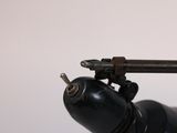 a small black object with a gun on top of it
