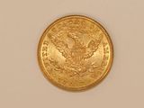 an image of a gold coin on a white surface