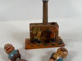 a bottle opener, cork opener, and cork stopper on a table