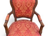 an old chair with red and gold upholstered upholstered upholstered upholstered uphol