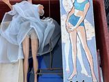 a box with a doll in it and a box with a doll in it