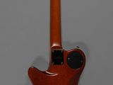 an image of a guitar that is on display on a wall