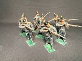the toy soldiers are dressed in uniform and holding their weapons