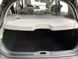the back of a car with the trunk open and the seats down