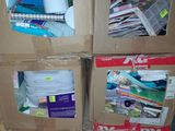 three boxes with various items in them stacked on a pallet