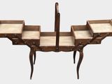an image of a set of three wooden chairs on a table