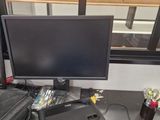 a computer monitor and a laptop on a desk