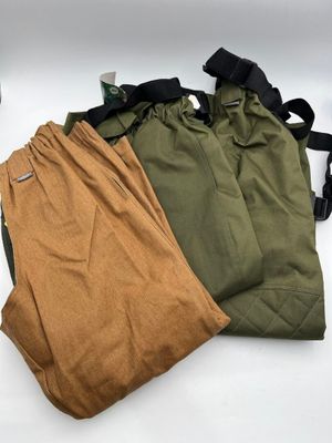 two pairs of green and brown pants sitting next to each other