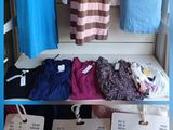 a picture of a display of clothing on a rack