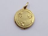 an image of a gold locke with flowers on it on a white surface