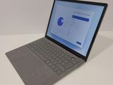 a laptop that is sitting on a white table