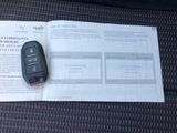a car key sitting on top of a piece of paper