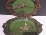 pair of green and brown plates with a picture of a castle in the background