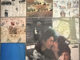a picture of a collage of records on the wall