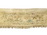 an antique embroidered table runner with floral designs and fringes