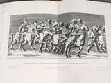 an open book with a picture of a group of people riding horses