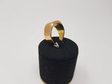 a gold ring sitting on top of a black box