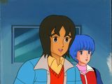 an image of a woman and a man standing next to each other in front of a window