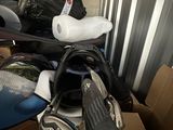 a box of golf clubs and a bag of golf balls