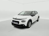a white citrole is parked in a white room