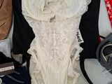 many different types of lingersuits laid out on a table