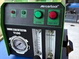 an image of a green and black machine sitting on top of a cardboard box