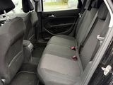 a black car with two seats in the back of it