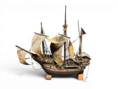 a small model of a pirate ship on a stand