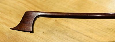 a close up of a handle on a wooden table
