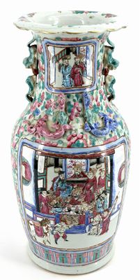 a large vase with a painting on it on a white surface