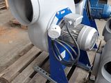 two blowers sitting on a pallet in a warehouse