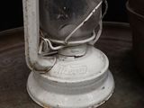 a white lantern sitting on top of a metal tray