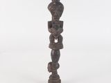 an image of a wooden sculpture of a man with a hat on his head