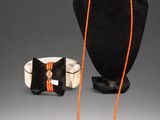 two pieces of jewelry including a necklace, bracelet, and ring