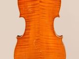 an old violin with a wooden back and a white background