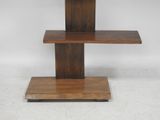 a close up of a wooden table with a shelf on it