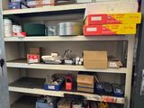 a metal cabinet with many boxes on it in a room