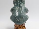 a small ceramic tree that is sitting on a table