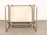an image of a metal frame chair with a leather seat