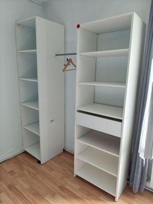 a closet in the corner of a room with a wooden floor