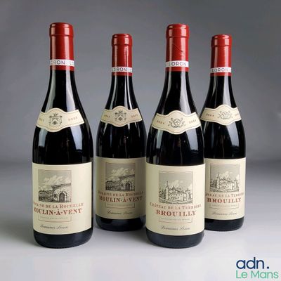 three bottles of red wine are lined up on a table